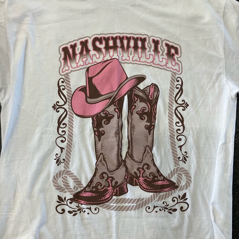 Women’s Nashville T-Shirt with cowboy boots.